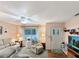 Inviting living room featuring cozy seating, ceiling fan, and lots of natural light at 2340 Ne 44Th St, Ocala, FL 34479