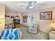 Cozy living room featuring a ceiling fan and access to other parts of the home at 2340 Ne 44Th St, Ocala, FL 34479