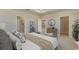 Main bedroom featuring ensuite bathroom and walk-in closet at 3076 Canopy Oak Blvd, Wildwood, FL 34785