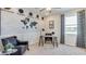 Office space featuring a desk, leather chair, and unique world map wall decor at 3080 Canopy Oak Blvd, Wildwood, FL 34785