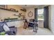 A well-appointed office with a large desk, built-in shelving, and comfortable seating area at 3080 Canopy Oak Blvd, Wildwood, FL 34785