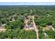 Beautiful aerial view highlighting both properties and the vast green space around it at 3112 Se 140Th Ln, Summerfield, FL 34491
