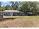 Large backyard with mature trees, ideal for recreation or expansion at 3112 Se 140Th Ln, Summerfield, FL 34491