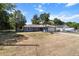 Well-maintained single-story home featuring a lush front yard and a two-car garage at 3112 Se 140Th Ln, Summerfield, FL 34491