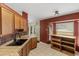 Kitchen with tile countertops, wood cabinetry, stainless steel sink, and natural lighting at 3112 Se 140Th Ln, Summerfield, FL 34491
