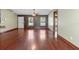 Spacious living room featuring hardwood floors, natural light, and neutral paint, perfect for entertaining at 3112 Se 140Th Ln, Summerfield, FL 34491