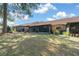 Backyard view of screened lanais and mature trees at 3449 Sw 19Th St, Ocala, FL 34474
