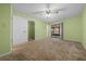 Bedroom with a fan and an access to a screened-in patio with ceiling fan at 3449 Sw 19Th St, Ocala, FL 34474