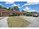 Inviting townhome with attached garage, terracotta roof, manicured lawn, and convenient driveway parking at 3449 Sw 19Th St, Ocala, FL 34474