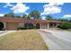 Charming single story home with mature landscaping, driveway, and attached garage at 3449 Sw 19Th St, Ocala, FL 34474