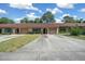 Charming single story home with mature landscaping, driveway, and attached garage at 3449 Sw 19Th St, Ocala, FL 34474