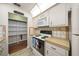 Well-equipped kitchen features white appliances and access to the pantry at 3449 Sw 19Th St, Ocala, FL 34474