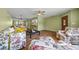 Spacious living area with wood floors, comfortable seating, and seamless access to the kitchen at 3449 Sw 19Th St, Ocala, FL 34474