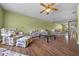 Inviting living room featuring hardwood floors and comfortable floral print furniture at 3449 Sw 19Th St, Ocala, FL 34474
