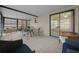 Enclosed patio with outdoor seating, tile flooring, and sliding door to interior at 3449 Sw 19Th St, Ocala, FL 34474