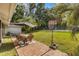 Spacious backyard featuring hot tub, an outdoor table set, and a basketball court at 400 Se 45Th Ter, Ocala, FL 34471