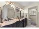 Updated bathroom featuring dual sinks, modern fixtures, and neutral paint colors at 400 Se 45Th Ter, Ocala, FL 34471