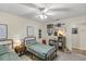 Bedroom with two twin beds, bookshelf, and wall decor at 400 Se 45Th Ter, Ocala, FL 34471