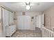 Cozy bedroom featuring a ceiling fan, closet, dresser, and an area rug at 400 Se 45Th Ter, Ocala, FL 34471