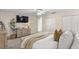Bright bedroom featuring a cozy bed with throw blanket and updated ceiling fan at 400 Se 45Th Ter, Ocala, FL 34471