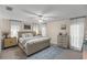 Bedroom boasts updated flooring, ceiling fan, and light and airy neutral colors at 400 Se 45Th Ter, Ocala, FL 34471