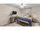 Bedroom featuring dark metal frame bed, neutral walls, and updated carpeting at 400 Se 45Th Ter, Ocala, FL 34471