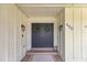 Elegant double front doors are adorned with wreaths, creating a welcoming entrance to the home at 400 Se 45Th Ter, Ocala, FL 34471