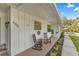 Inviting front porch features rocking chairs and fresh landscaping at 400 Se 45Th Ter, Ocala, FL 34471