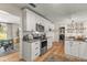 Updated kitchen boasts white cabinets, modern appliances, and plenty of countertop space at 400 Se 45Th Ter, Ocala, FL 34471