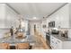 Spacious kitchen with white cabinetry, granite countertops, and stainless steel appliances at 400 Se 45Th Ter, Ocala, FL 34471