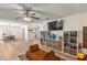 Open-concept space flows seamlessly into the dining area, featuring hardwood floors and natural light at 400 Se 45Th Ter, Ocala, FL 34471