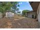 Spacious backyard features a storage shed and an AC unit; great for additional storage or outdoor projects at 408 Etheredge St, Bushnell, FL 33513