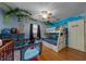 A bedroom with bunk beds, a crib, hardwood floors, and nature-themed decor at 408 Etheredge St, Bushnell, FL 33513