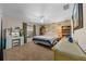 Bedroom featuring light walls, carpet floors, ceiling fan, and floral wallpaper accent wall at 408 Etheredge St, Bushnell, FL 33513