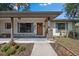 Inviting home featuring a walkway to the front door and lovely landscaping at 408 Etheredge St, Bushnell, FL 33513