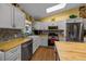 Kitchen featuring stainless steel appliances, hardwood floors, and stylish countertops at 408 Etheredge St, Bushnell, FL 33513