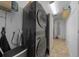 Functional laundry room featuring modern front load washer and dryer and built-in storage solutions at 408 Etheredge St, Bushnell, FL 33513