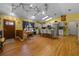 Spacious open-concept area with hardwood floors and a dining space at 408 Etheredge St, Bushnell, FL 33513