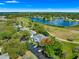 Scenic aerial view of condo community with a lake and golf course at 450 Fairways Cir # A101, Ocala, FL 34472