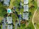 Overhead view of condo community with lush greenery, parking, and golf course at 450 Fairways Cir # A101, Ocala, FL 34472