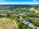 Aerial view of condos near golf course with lush trees in the neighborhood at 450 Fairways Cir # A101, Ocala, FL 34472
