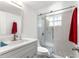 Well-lit bathroom with a sleek glass-enclosed shower and modern vanity at 450 Fairways Cir # A101, Ocala, FL 34472