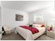 Inviting bedroom with plush bedding, decorative pillows, and a bright window creating a tranquil retreat at 450 Fairways Cir # A101, Ocala, FL 34472