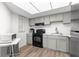 Efficient kitchen features gray cabinets, modern appliances, and plenty of counter space at 450 Fairways Cir # A101, Ocala, FL 34472
