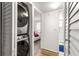 Efficient laundry closet with a stackable washer and dryer for space-saving convenience at 450 Fairways Cir # A101, Ocala, FL 34472