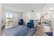 Spacious living area with wood floors, cozy seating, and a dining area with sliding glass doors at 450 Fairways Cir # A101, Ocala, FL 34472