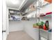 Organized walk-in closet with shelving, offering ample storage space for clothes, shoes, and accessories at 450 Fairways Cir # A101, Ocala, FL 34472