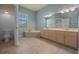 Bright bathroom featuring a large tub, tile floors, double vanity and neutral color palette at 4735 Se 35Th St, Ocala, FL 34480