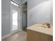 Bathroom featuring a glass shower, great lighting and a door to the outside at 4735 Se 35Th St, Ocala, FL 34480