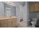 Bathroom featuring a nice vanity with sink, and a toilet tucked away into the corner at 4735 Se 35Th St, Ocala, FL 34480